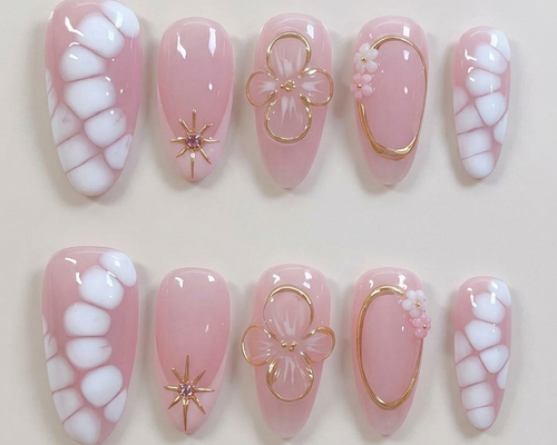 Set of pink and white nail designs with decorative elements on a light background