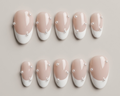 Set of nails with a gradient design featuring pink and white colors, decorated with small pearls on a neutral background.